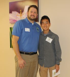 Two generations of support for 4CCF: Board Trustee, Jason Verlinde and YAC member, Noah